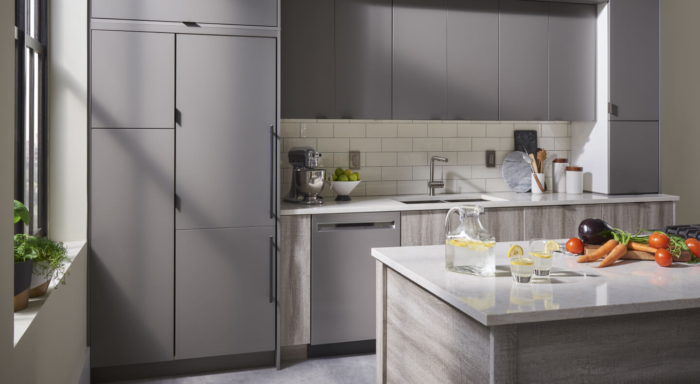 A gray panel-ready refrigerator that matches the surrounding cabinetry