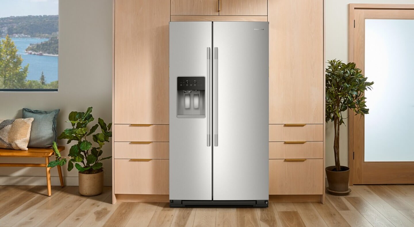 A side-by-side refrigerator surrounded by wooden cabinets