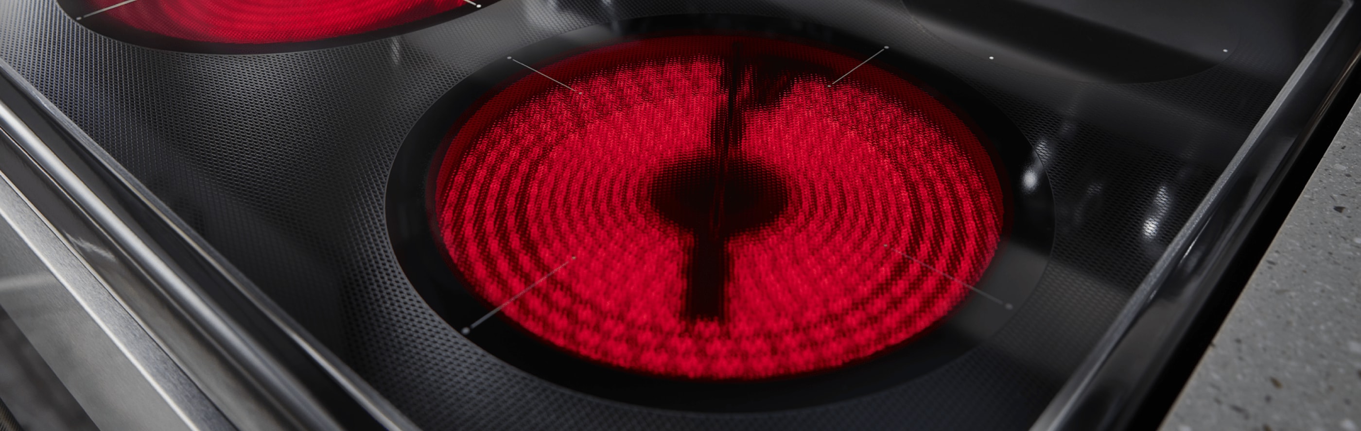 Close-up of an electric stovetop burner red with heat