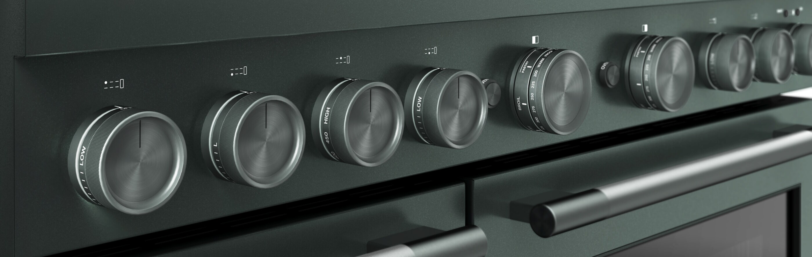 A close-up of the temperature dials on a commercial-style range