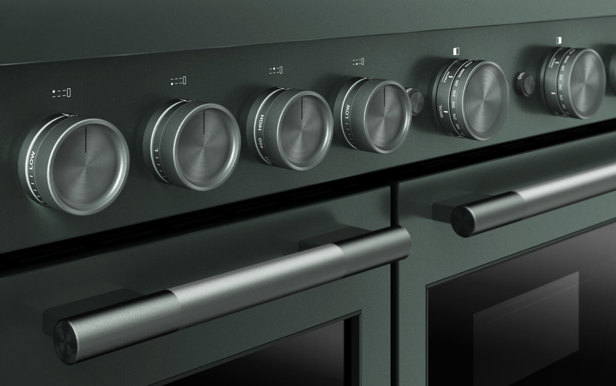 A close-up of the temperature dials on a commercial-style range