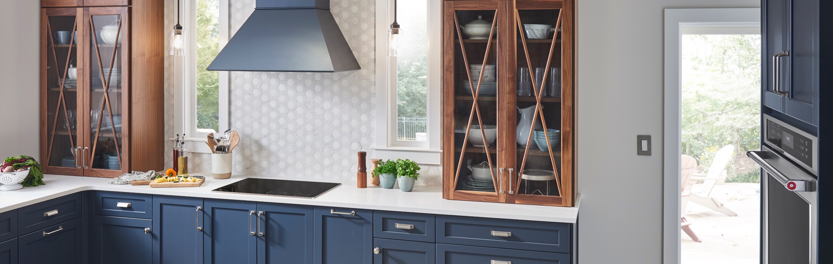 KitchenAid® cooktop and range hood in a modern kitchen