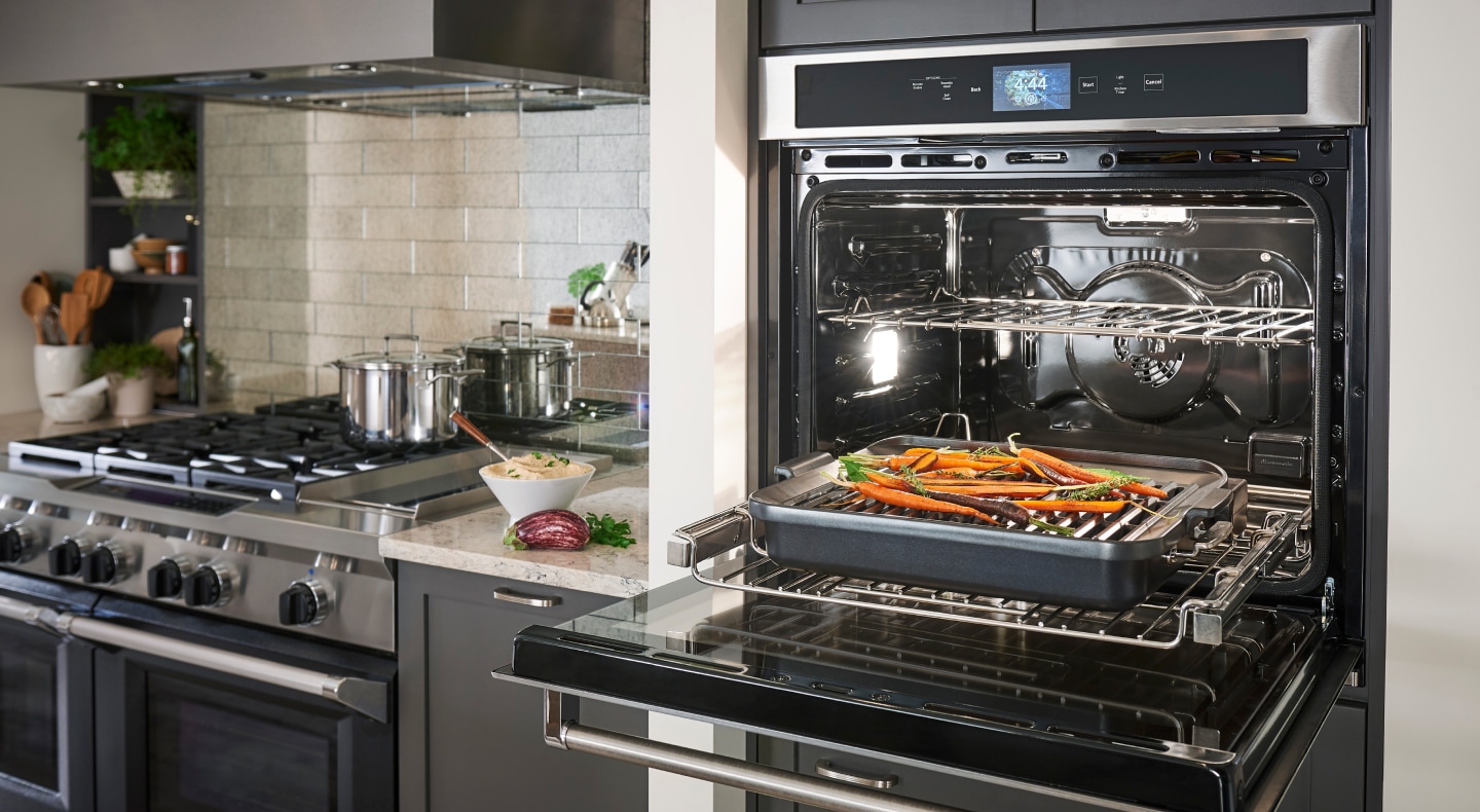 Roasted carrots on a baking sheet in a KitchenAid® wall oven Roasted carrots on a baking sheet in a KitchenAid® wall oven