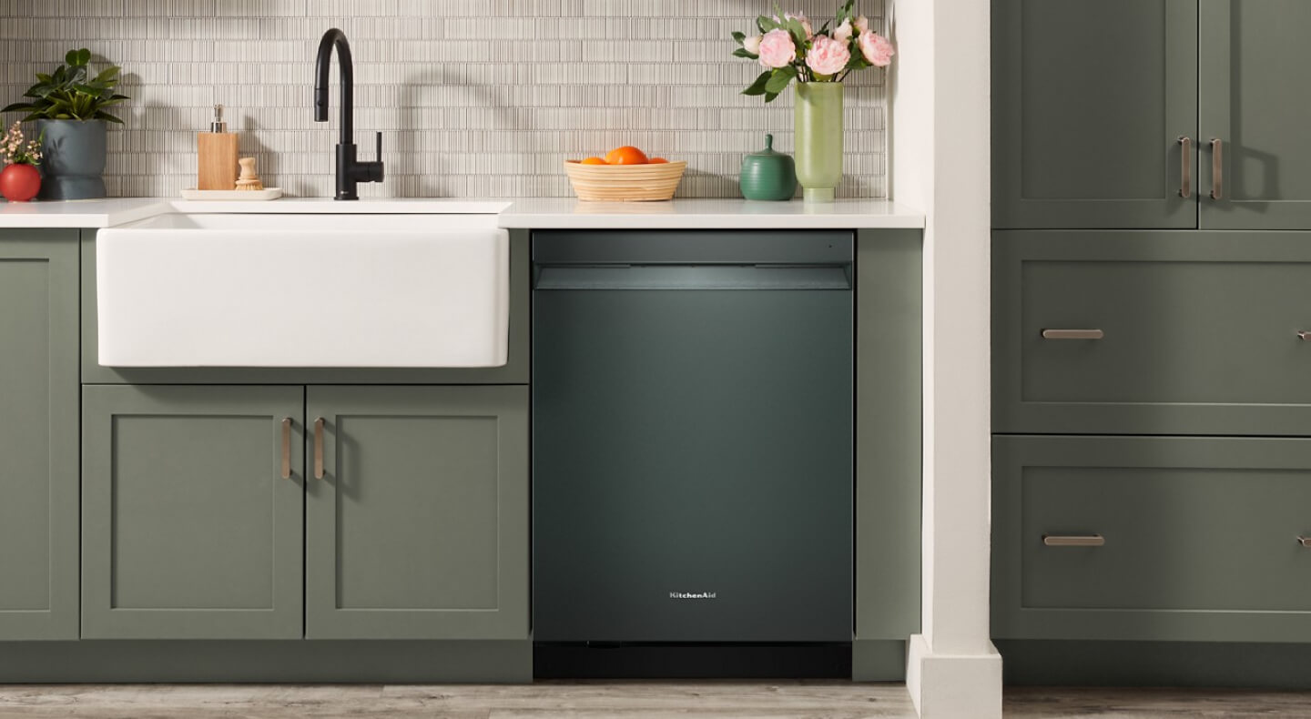 Juniper colored KitchenAid® dishwasher in gray-green cabinetry