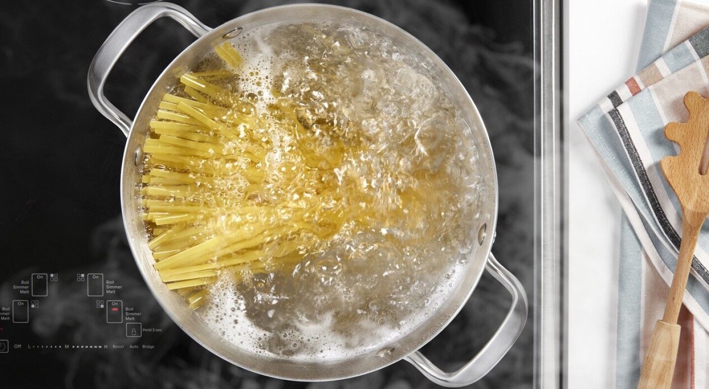 Noodles cooking in a pot