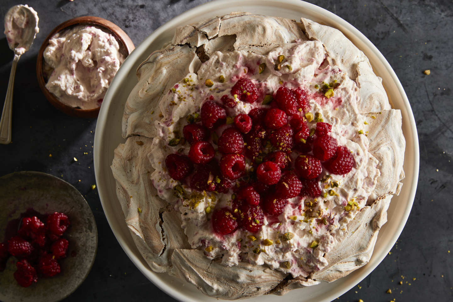 A chocolate pistachio pavlova with raspberry cream. A chocolate pistachio pavlova with raspberry cream.