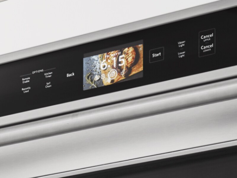 A close up of an oven control panel. 