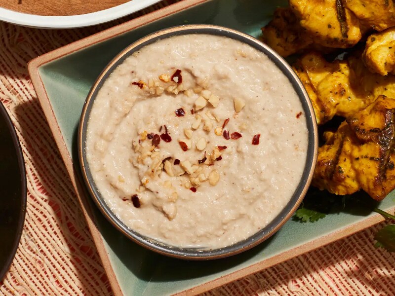 Homemade dipping sauce garnished with slivered nuts