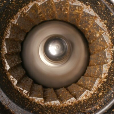 Coffee grinds in a burr coffee grinder