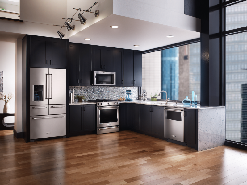 Stainless steel refrigerator with bottom freezer in L-shaped kitchen Stainless steel refrigerator with bottom freezer in L-shaped kitchen