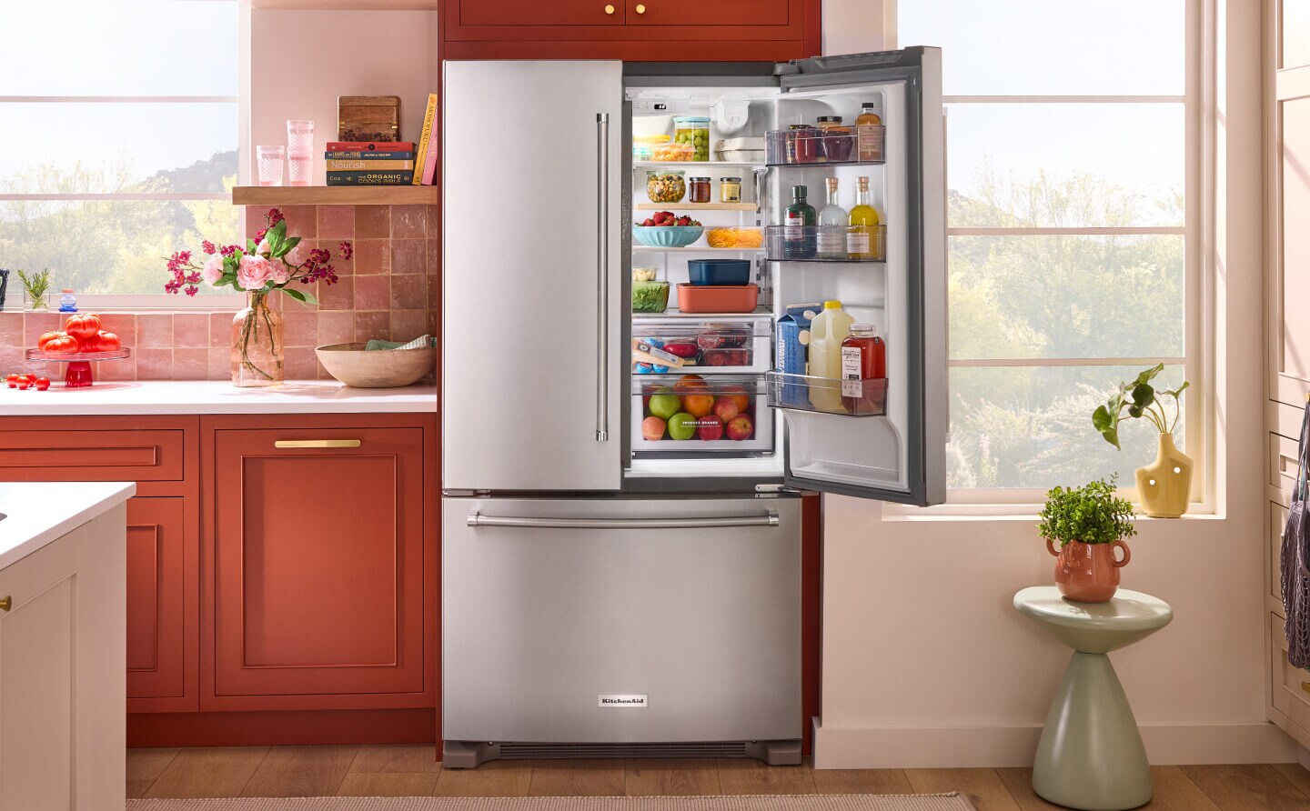 A French door KitchenAid® refrigerator against terracotta cabinets