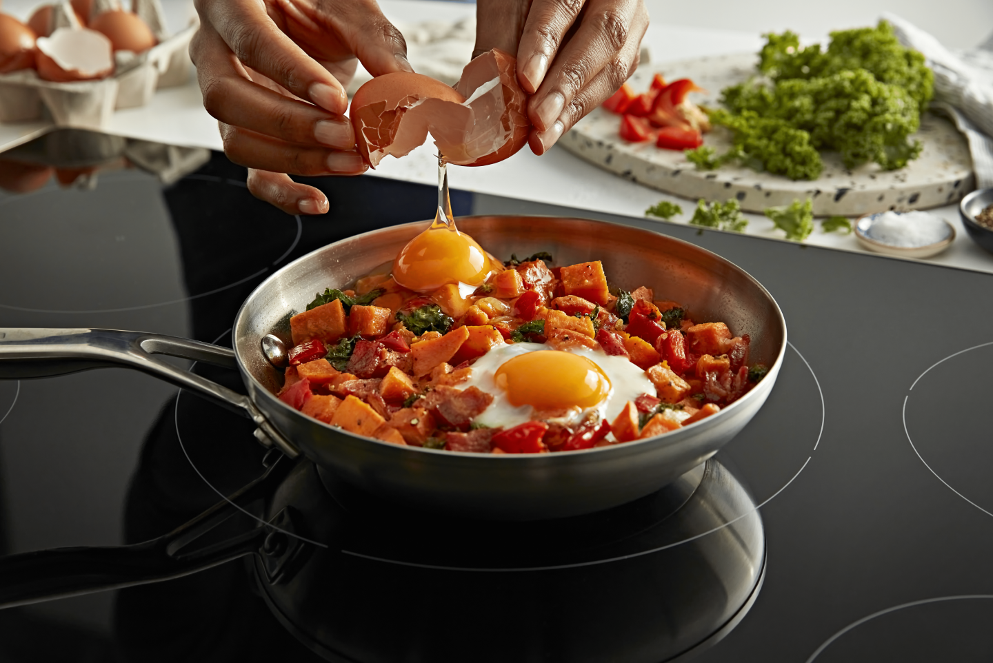 A person cracking an egg into a dish A person cracking an egg into a dish