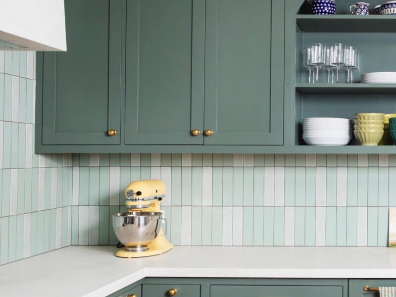 Blue/green cabinets in a kitchen