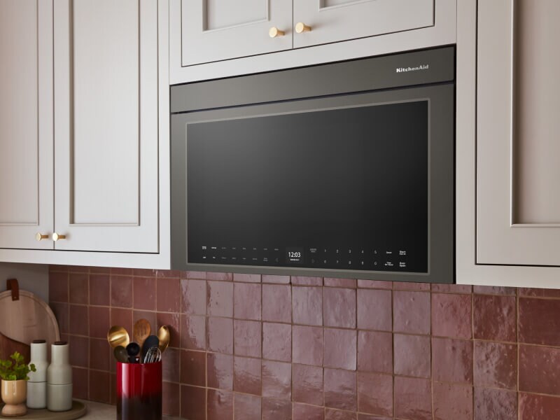 KitchenAid® over-the-range microwave built into cream-colored cabinetry