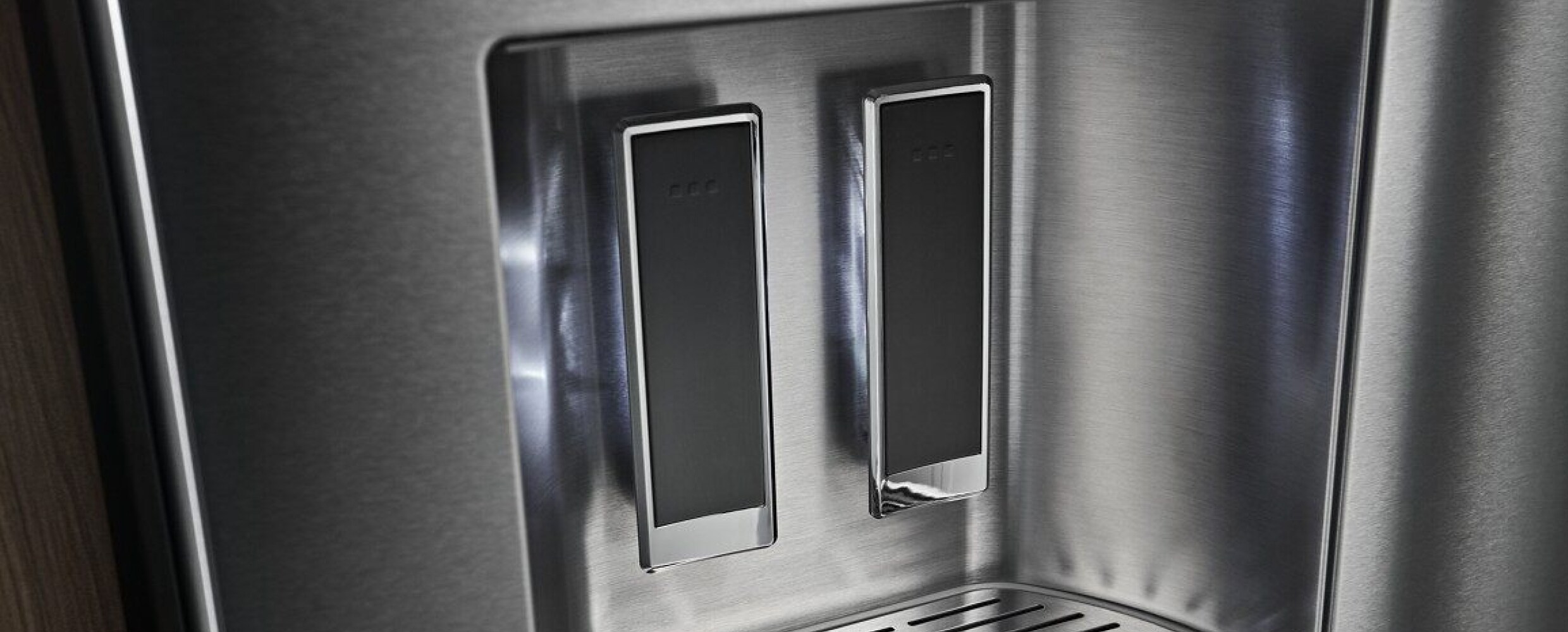 External water dispenser illuminated on the KitchenAid® French Door Bottom Mount Refrigerator.