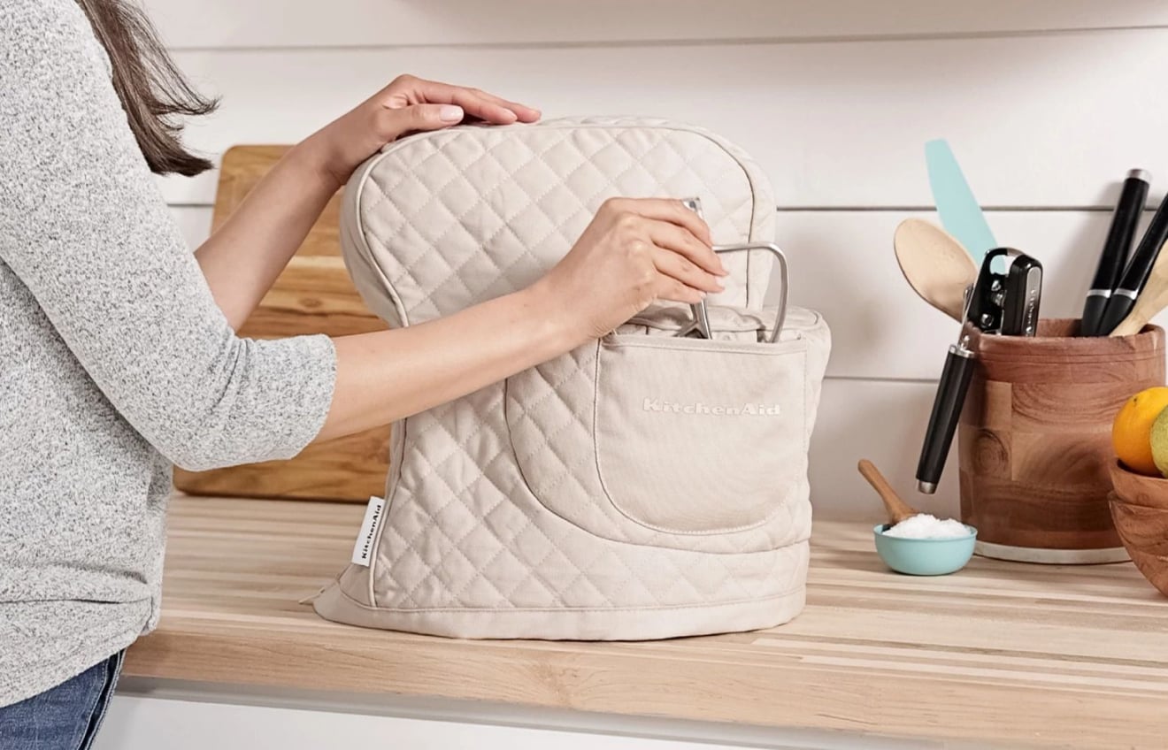Person removing KitchenAid® Stand Mixer Cover