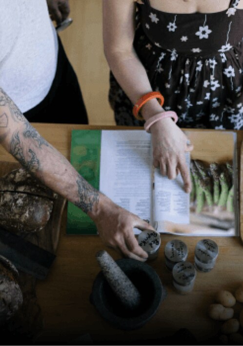 People looking at cookbook