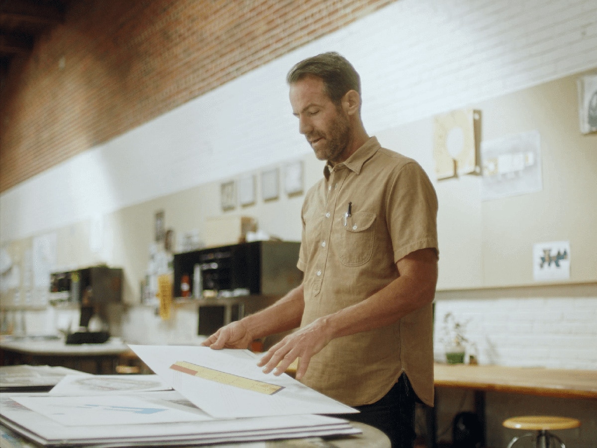 Mike Moore reviewing his work.