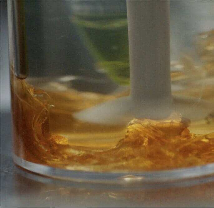 A sample of honey being tested in a lab.