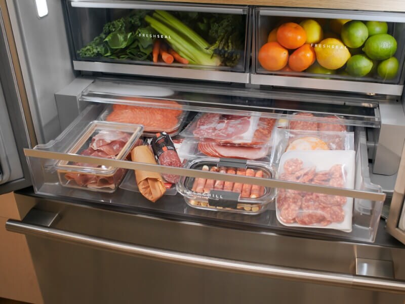 Drawers open to show refrigerator storage