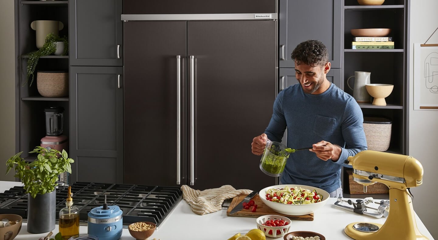 Person preparing food at an island