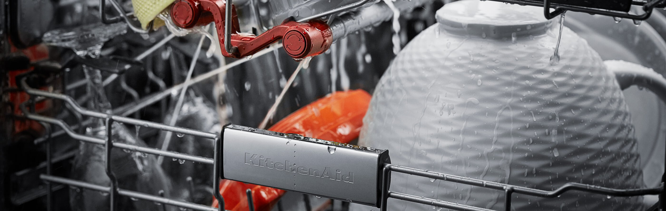 Close-up of dishes rinsing in a dishwasher