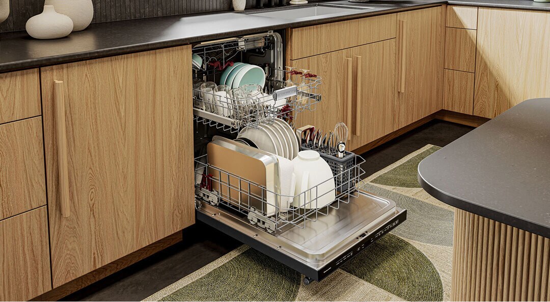 Open dishwasher filled with dishes and glassware