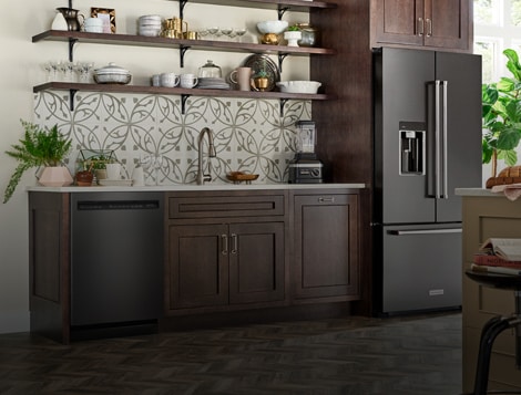 Refrigerator and sink in a kitchen
