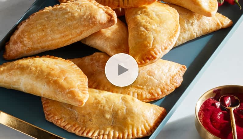 Hibiscus empanadas on a plate.