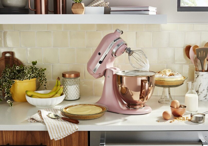 Pies next to a pink KitchenAid® Stand Mixer whipping cream in a copper bowl Pies next to a pink KitchenAid® Stand Mixer whipping cream in a copper bowl