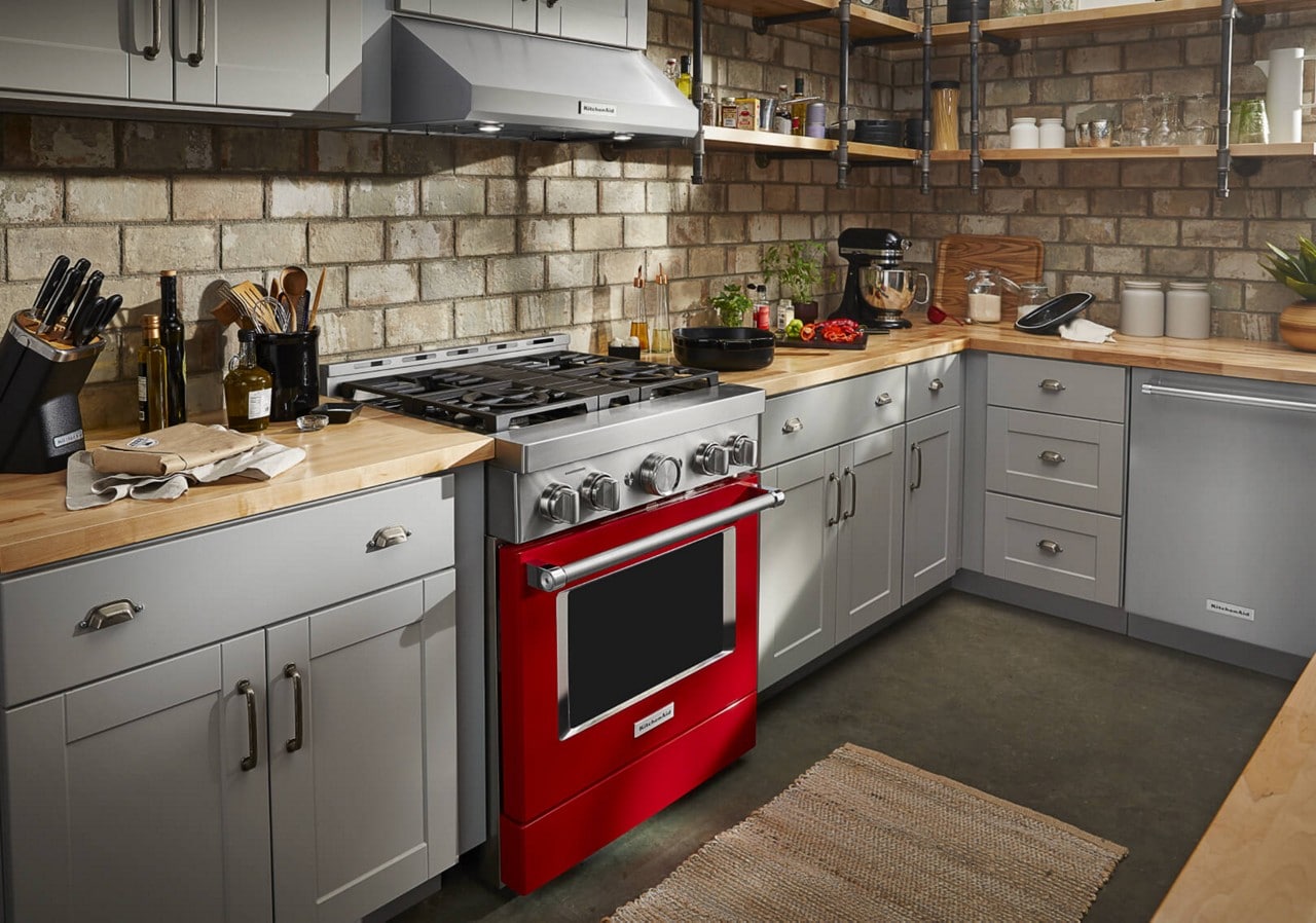 A fully equipped kitchen with a Red KitchenAid® Gas Range A fully equipped kitchen with a Red KitchenAid® Gas Range
