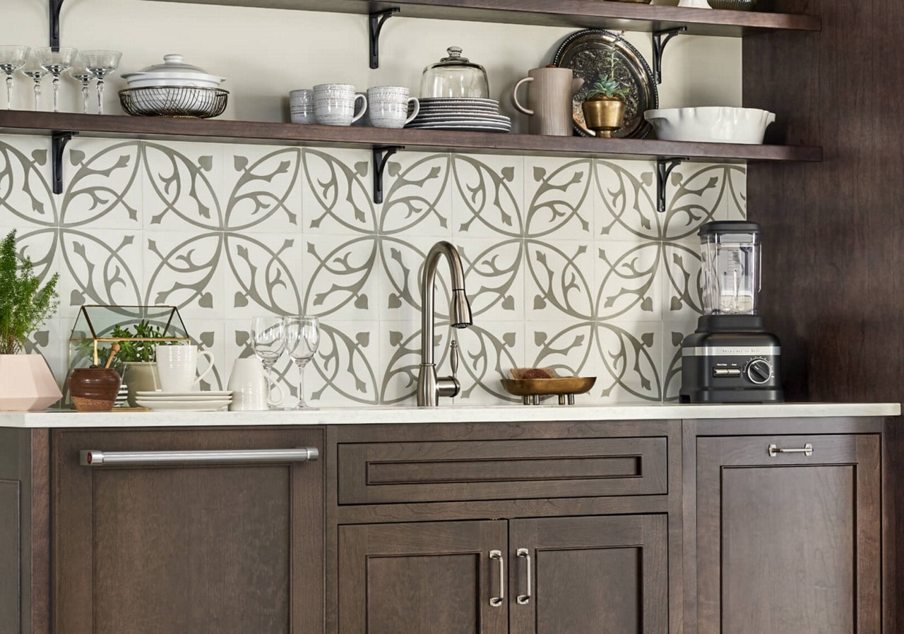 A clean kitchen sink area with dark wood cabinetry A clean kitchen sink area with dark wood cabinetry