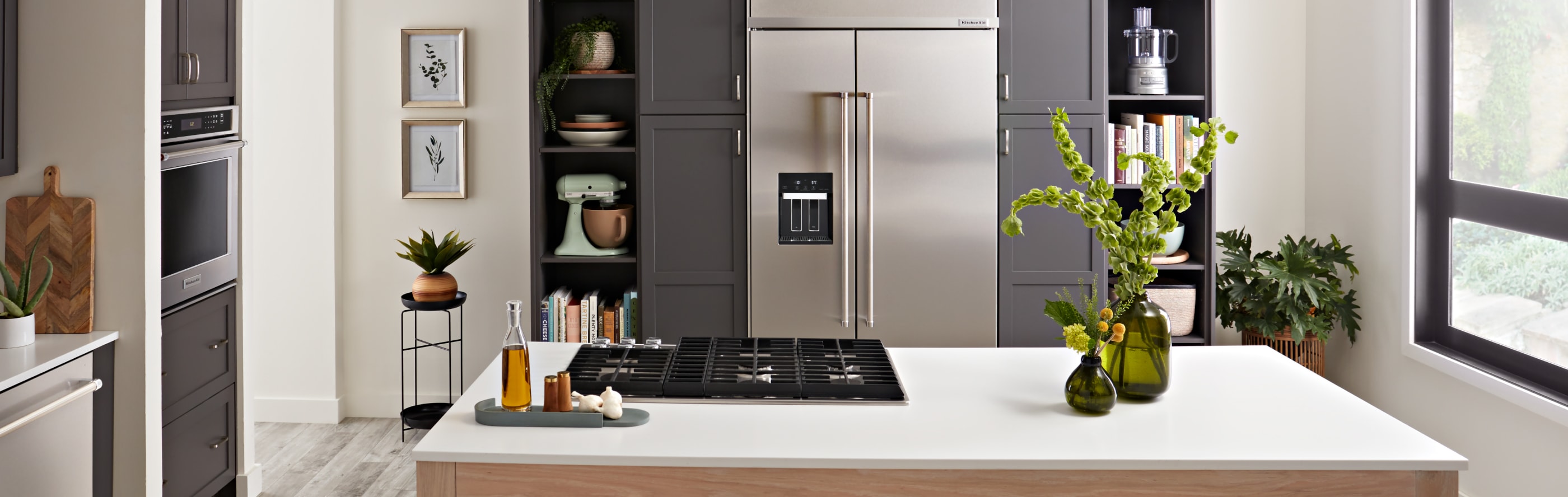 Kitchen island in front of built-in refrigerator