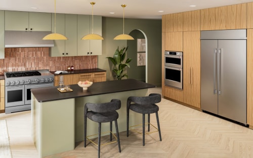 A modern kitchen in wood tones and stainless steel