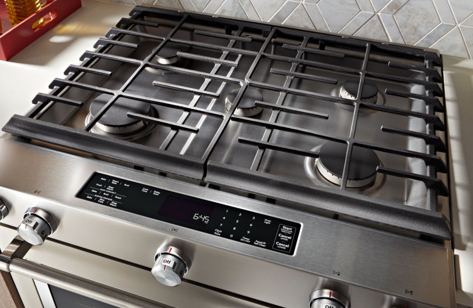 A 5-burner gas stovetop shown from overhead