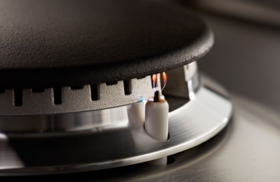 Close-up of a burner port with flame ignited Close-up of a burner port with flame ignited