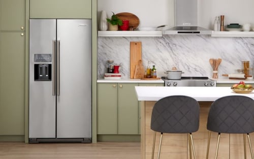 A modern kitchen with a stainless steel side-by-side refrigerator