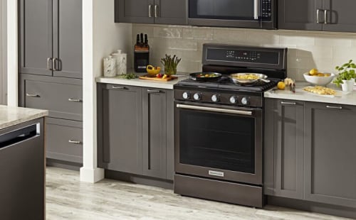 KitchenAid black stainless steel oven range in light gray cabinets