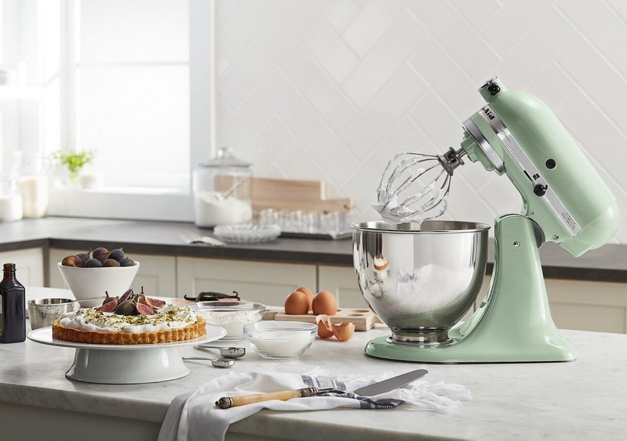 Green KitchenAid® stand mixer with whisk attached
