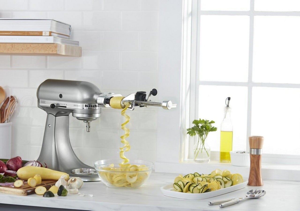 Silver KitchenAid® stand mixer with peel, core, and slice attachment
