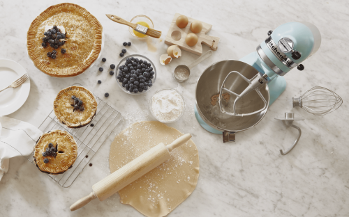 KitchenAid® stand mixer with blueberry pie, tarts, ingredients and homemade pie dough