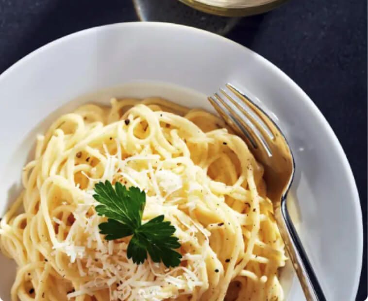 Cacio e Pepe pasta in white bowl. Cacio e Pepe pasta in white bowl.