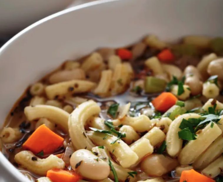 Bowl of pasta with carrots, beans and herbs. Bowl of pasta with carrots, beans and herbs.
