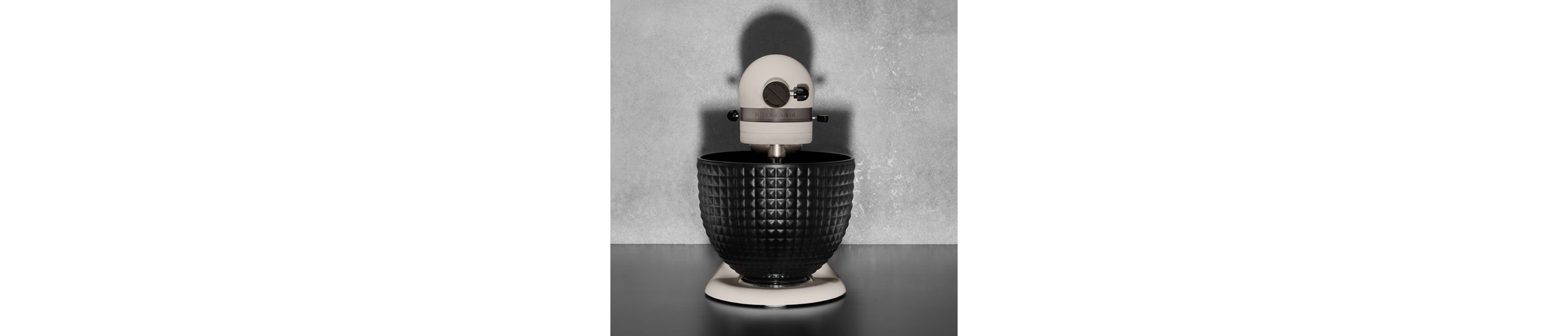 A Limited Edition Stand Mixer with Black Stainless Bowl on a kitchen counter.