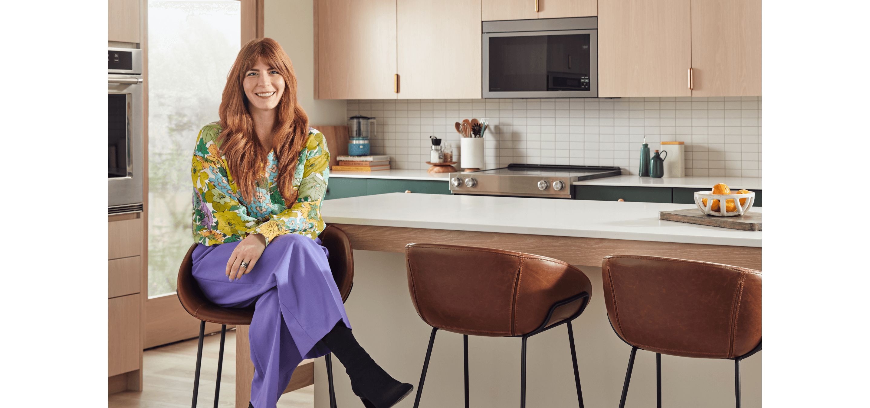 Brittni Pertijs in a sleek, modern kitchen.