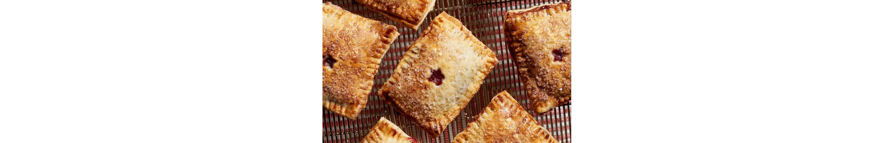 Individual hand pies on a cooling rack.