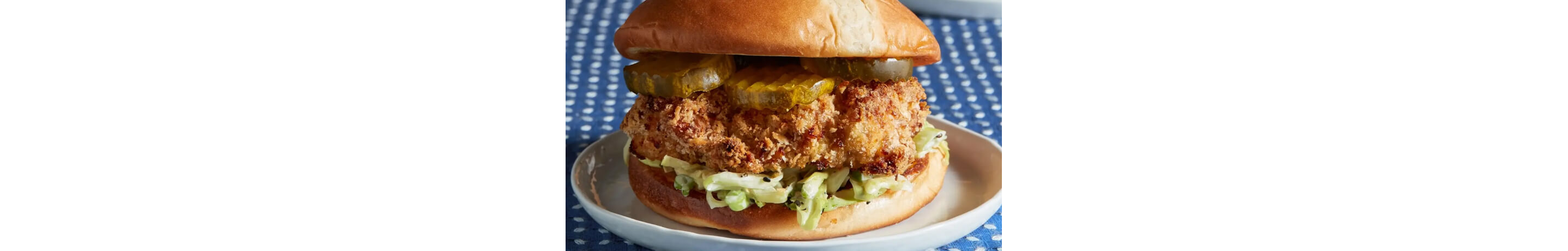 A crispy chicken sandwich on a plate.