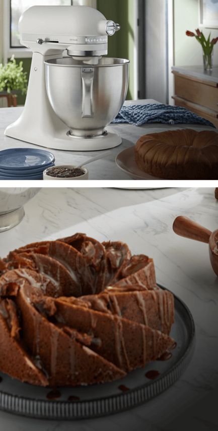 A Porcelain White Stand Mixer on a countertop. Plus, a prepared cake on a counter, drizzled with icing.