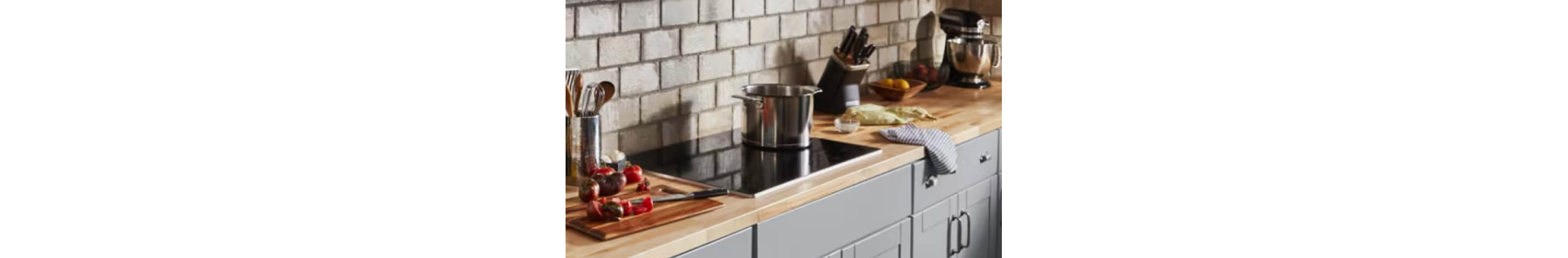 Induction cooktop with large pot on top.