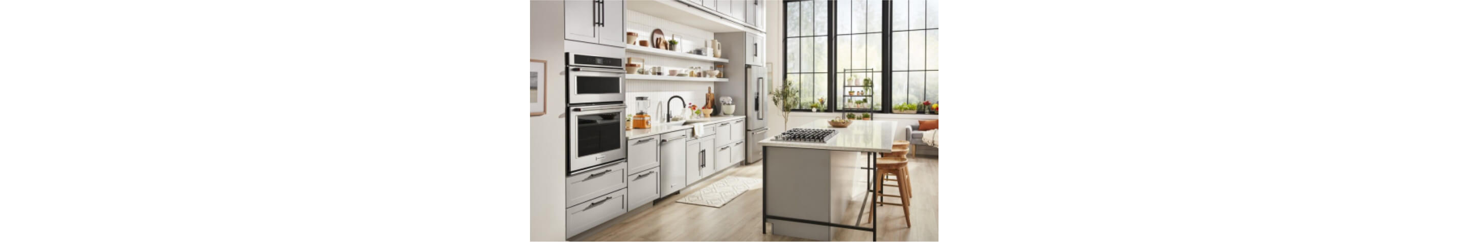 A bright white kitchen outfitted with KitchenAid® appliances.